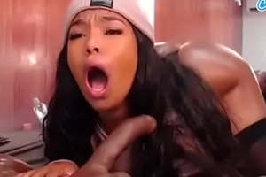 Oriental woman sucking on a big unconscionable dildo on reside cam